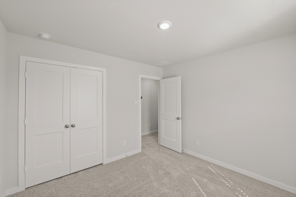A room with white doors.