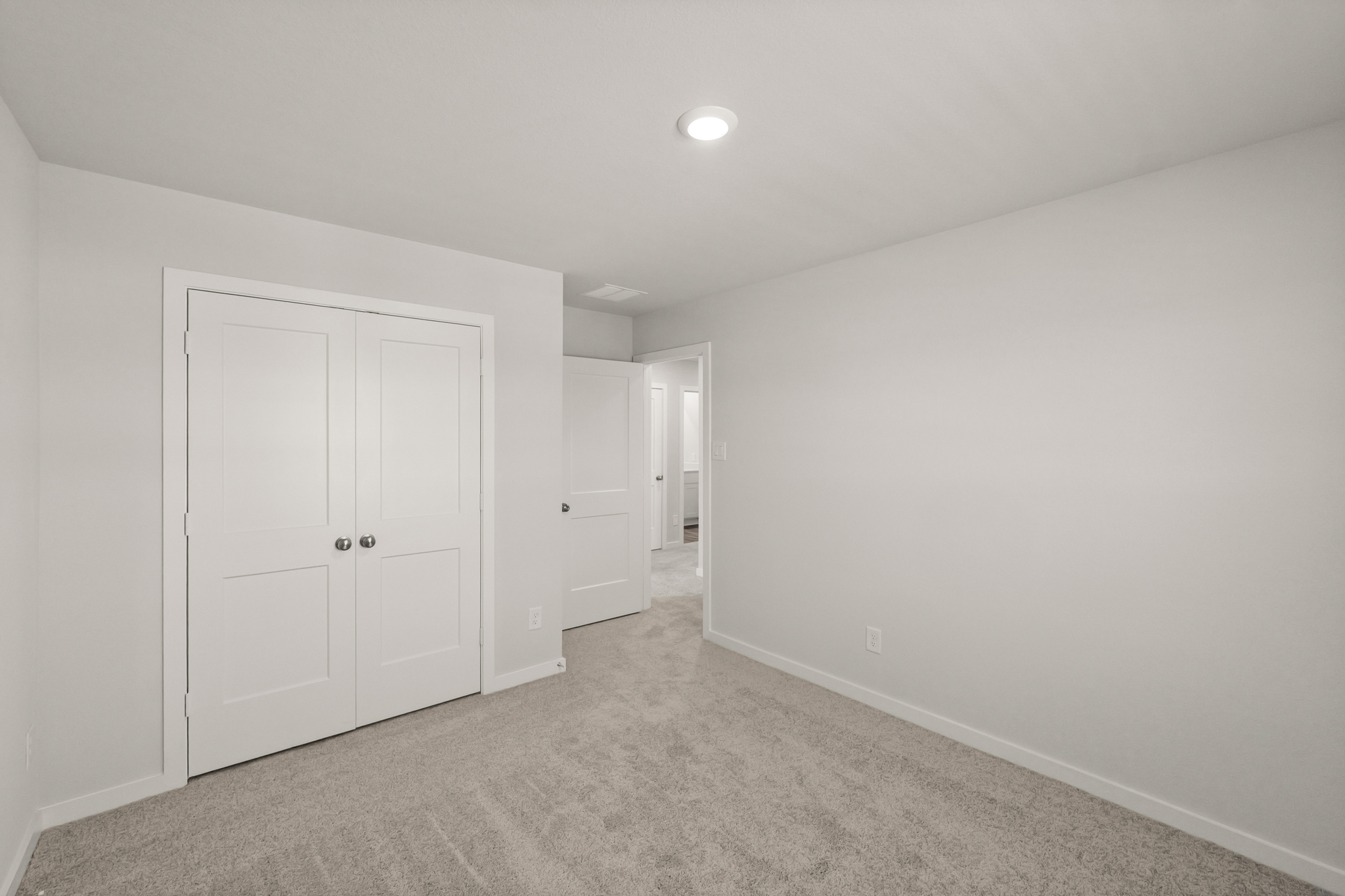 A room with white doors.