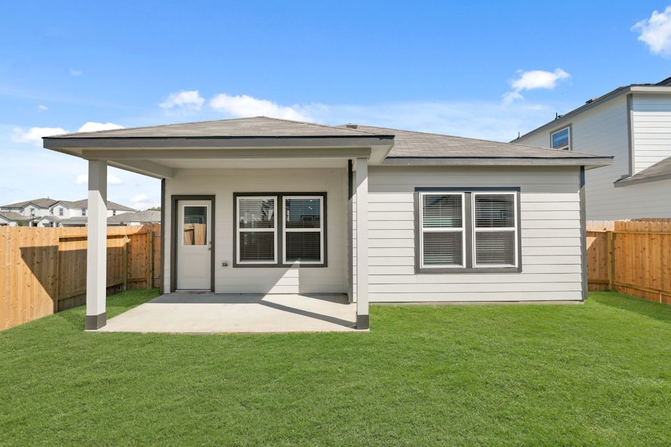 A house with a fence around it.
