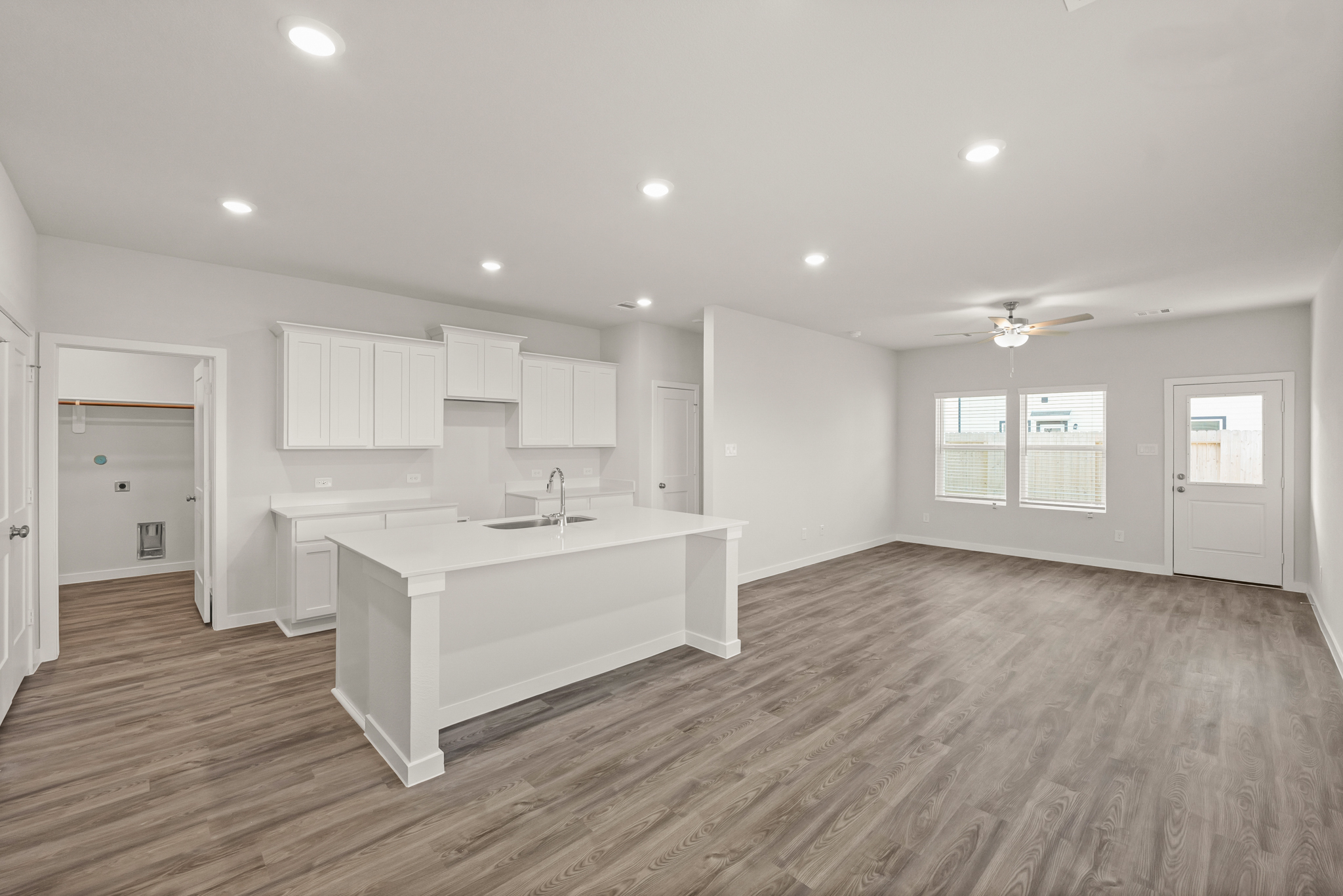 A large kitchen with white cabinets.