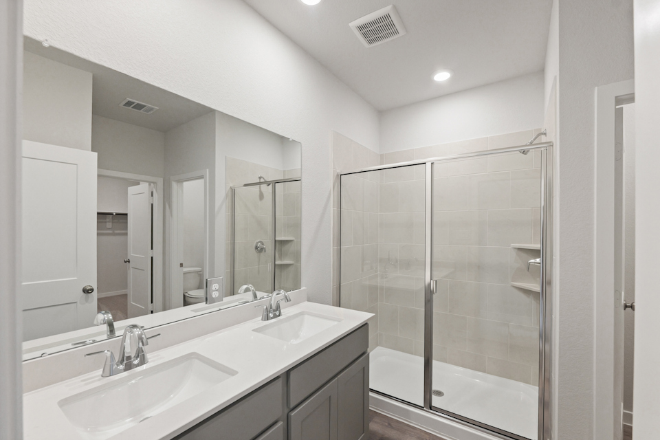 A bathroom with a glass shower.