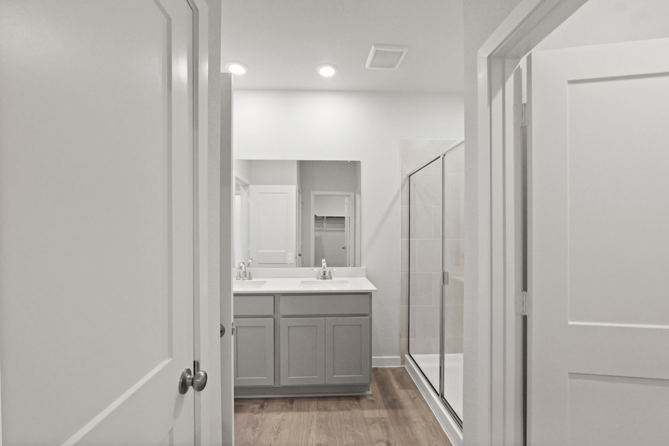 A bathroom with a glass shower.