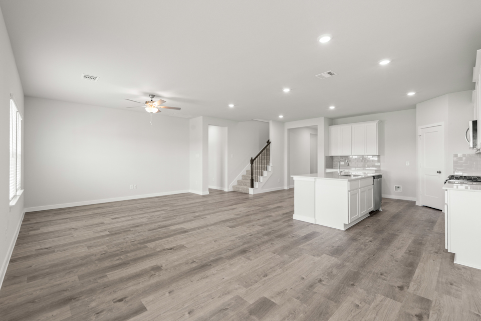 A large kitchen with white cabinets.