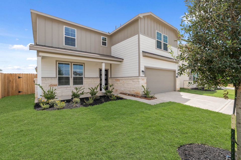 A house with a large front yard.
