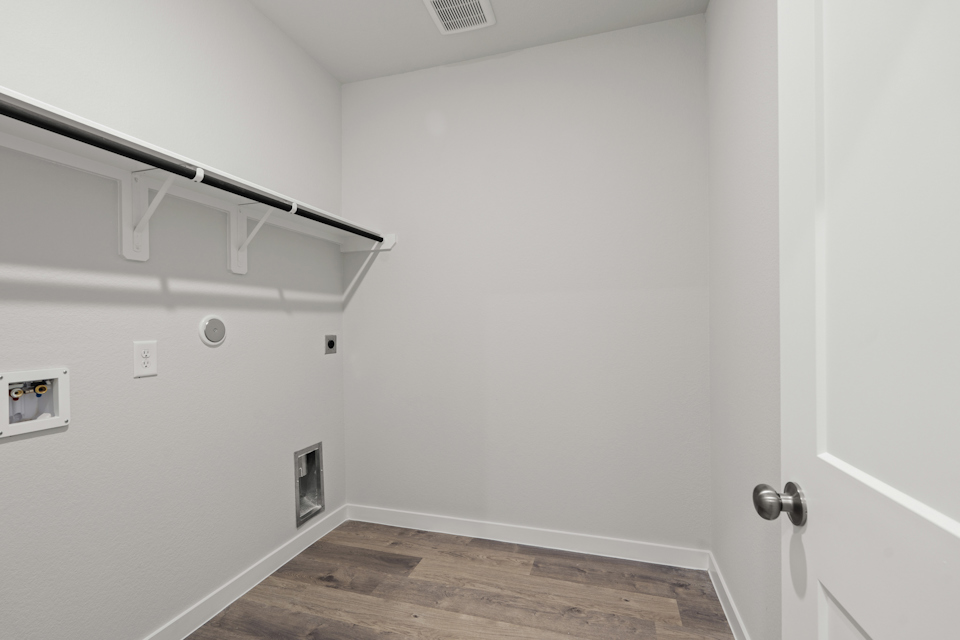 A hallway with white walls.