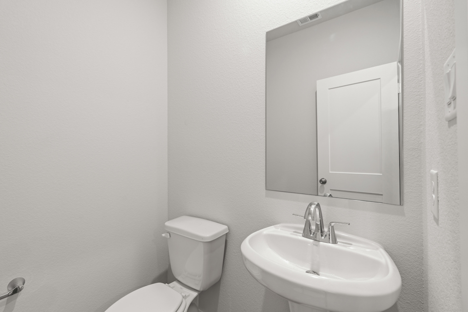 A bathroom with a sink and toilet.