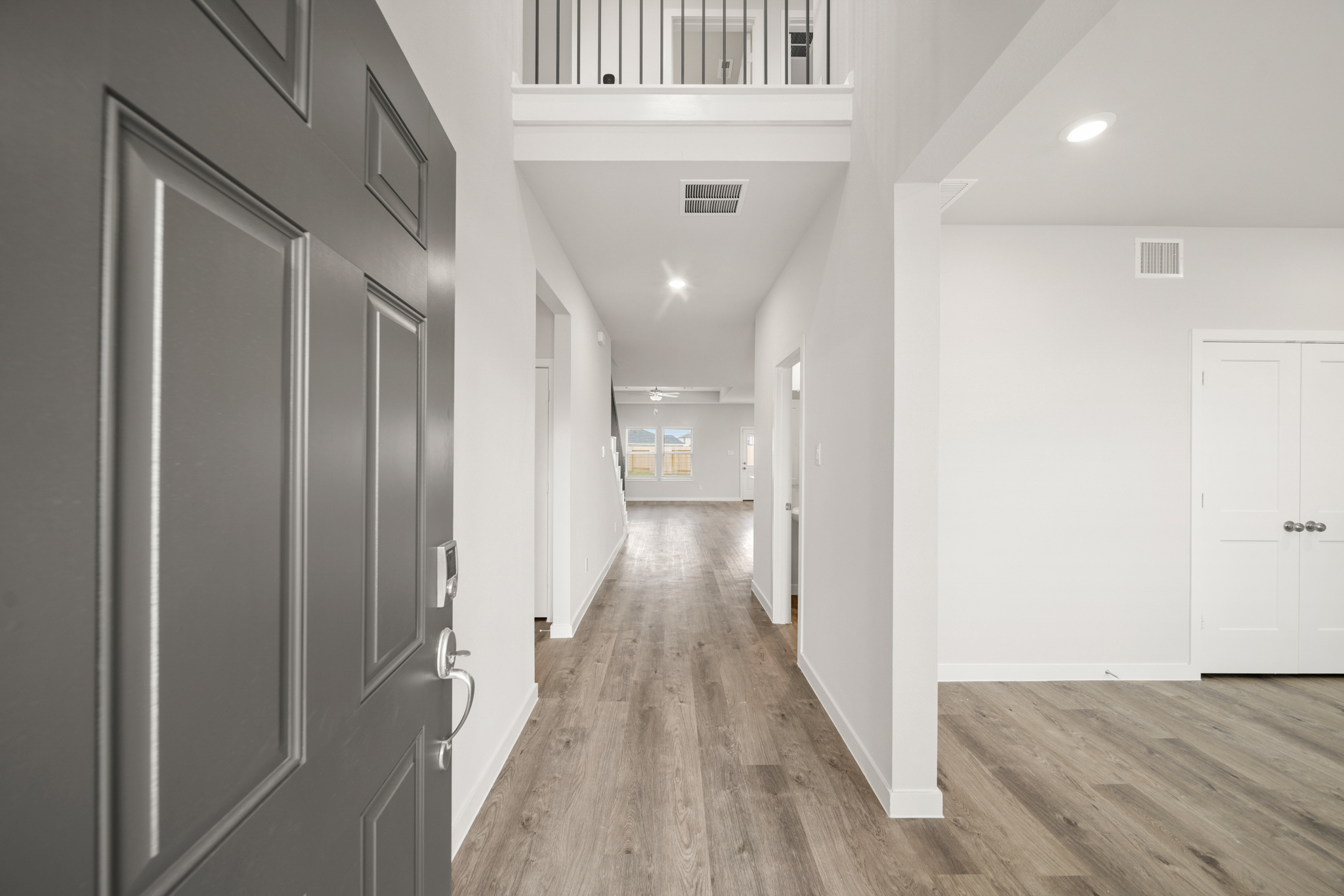 A hallway with white doors.