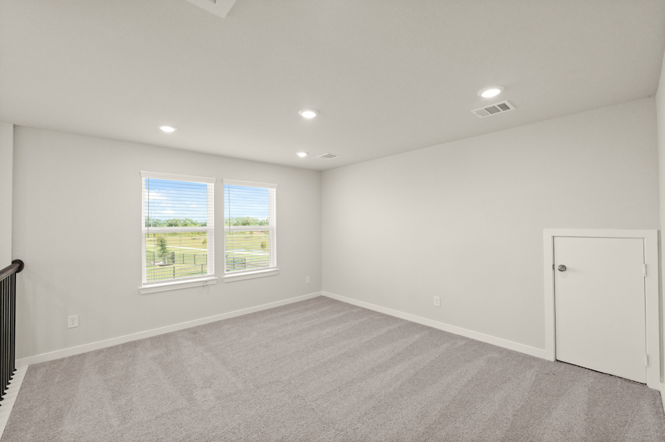 A room with a window and a door.