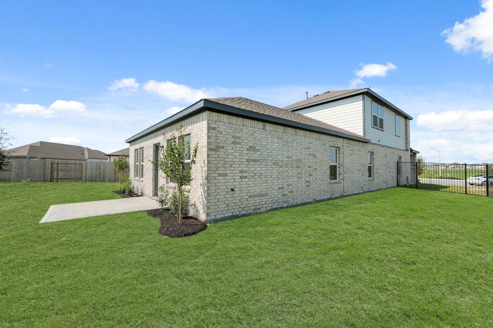 A house with a fence and a yard.