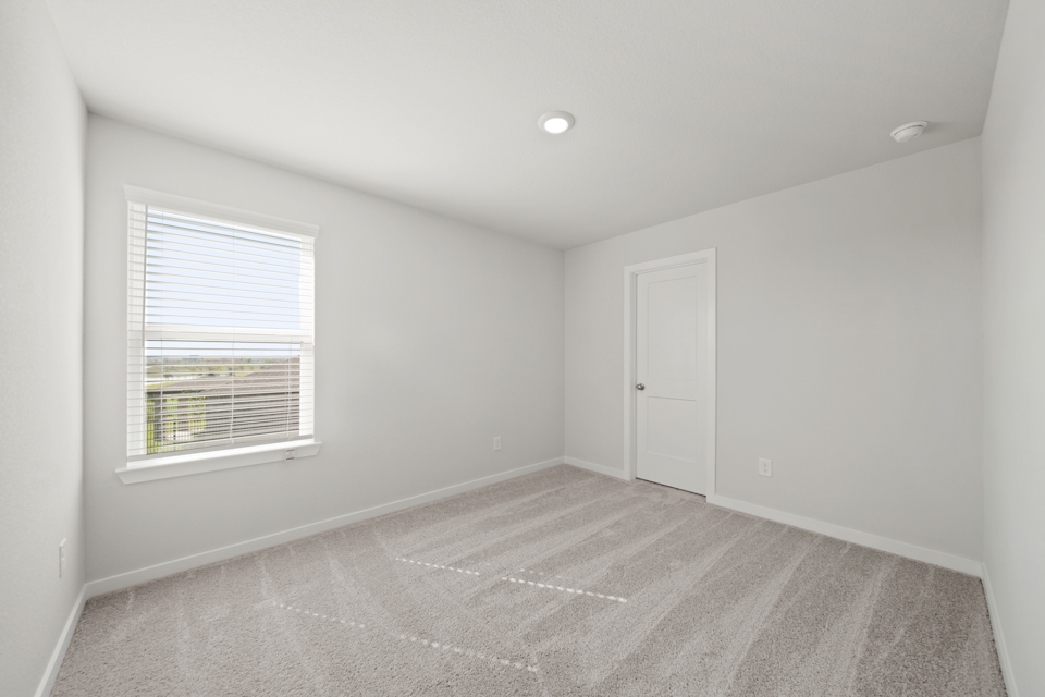 A room with a door and a window.