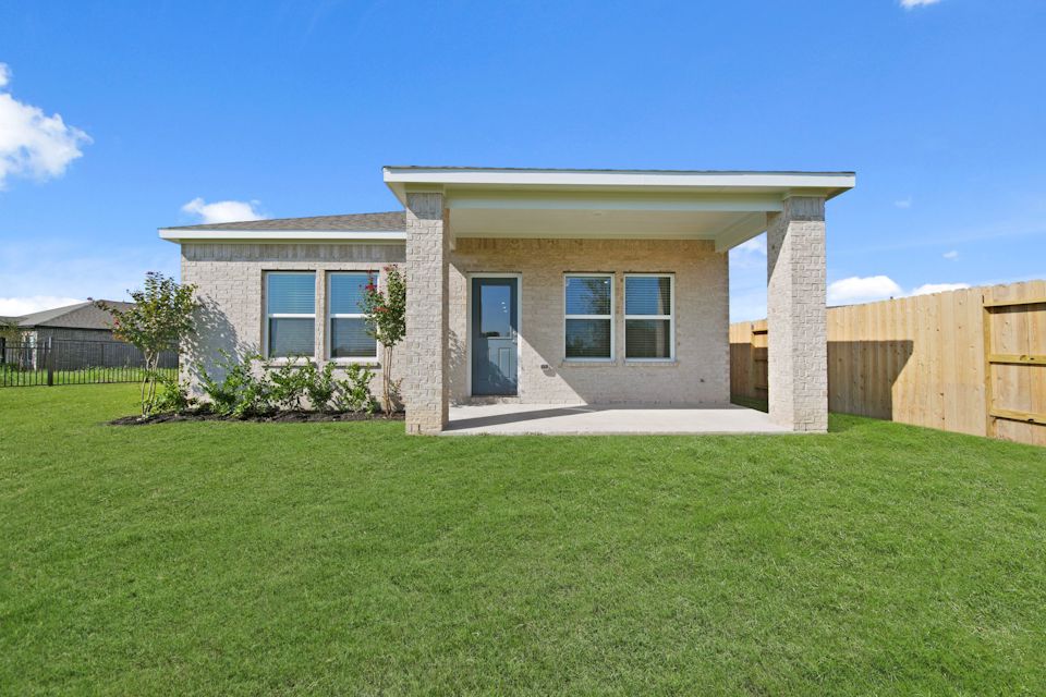 A house with a grass yard.