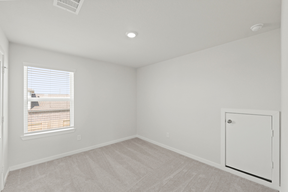 A room with a window and a door.