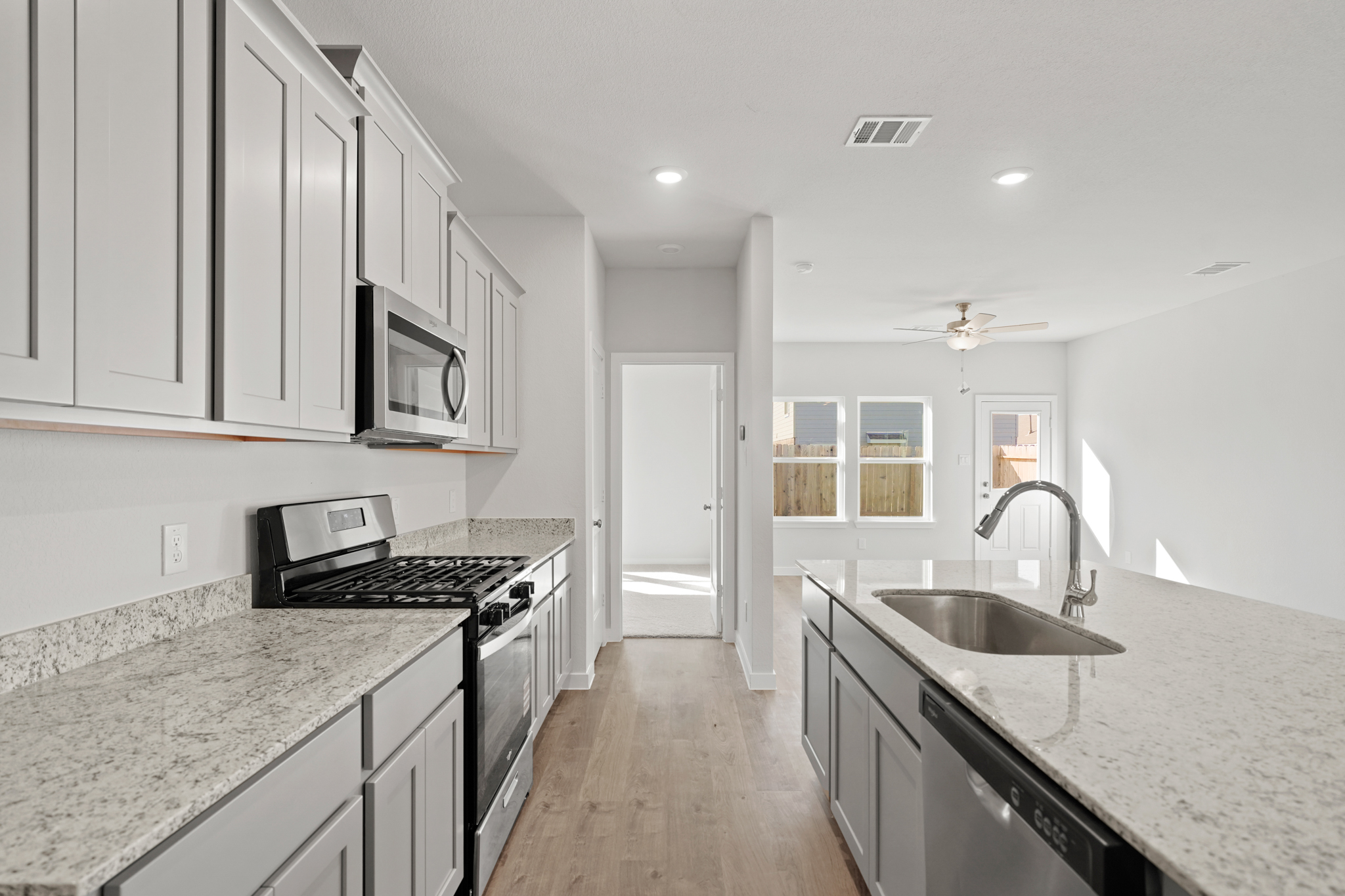 A kitchen with black appliances.