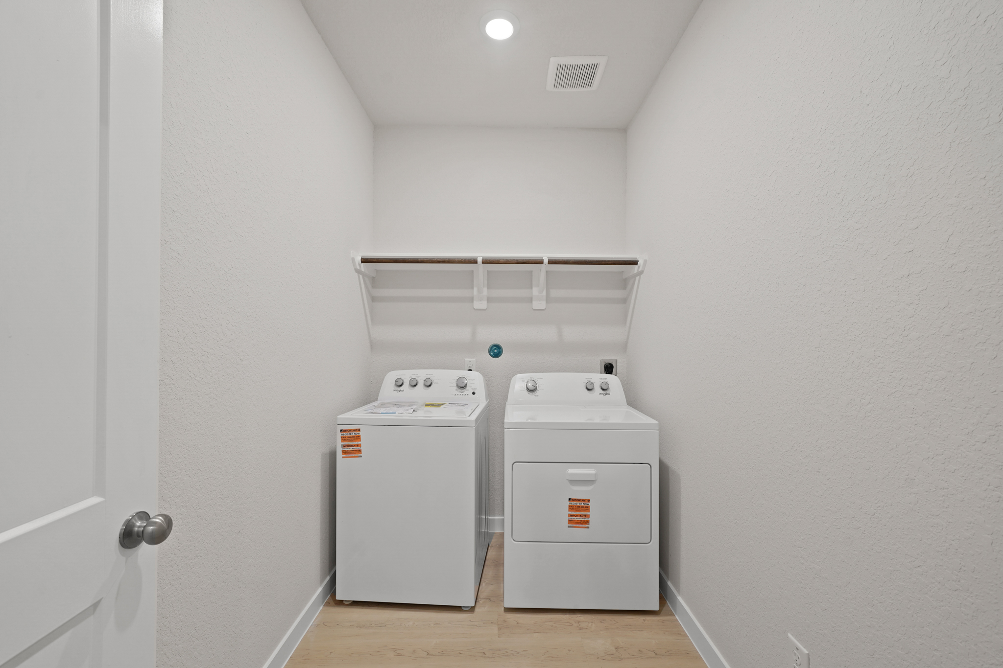 A laundry room with a washer and dryer.
