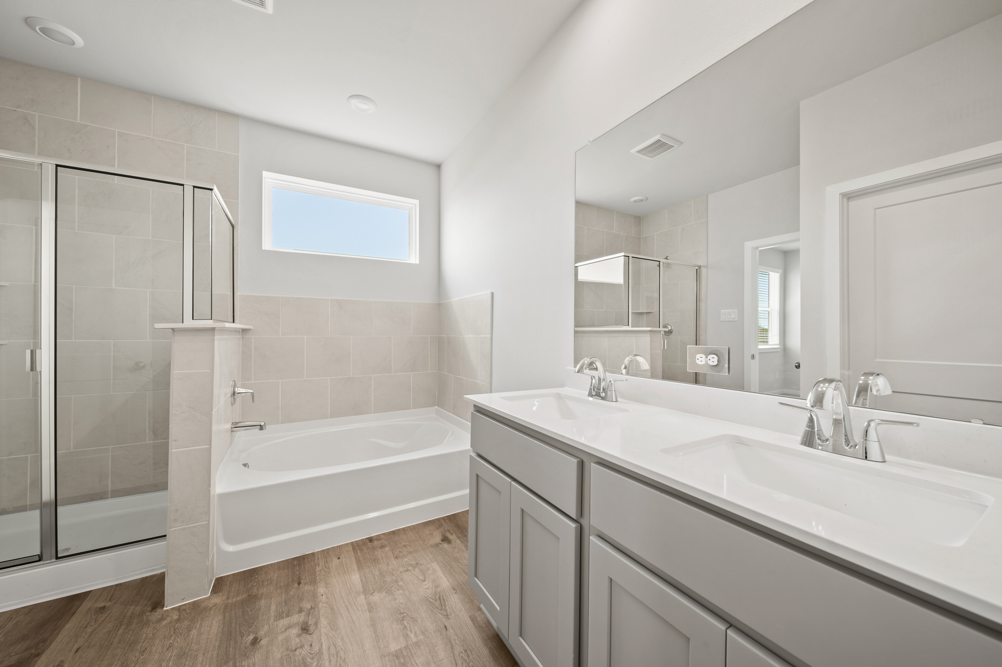 A bathroom with a tub and sink.