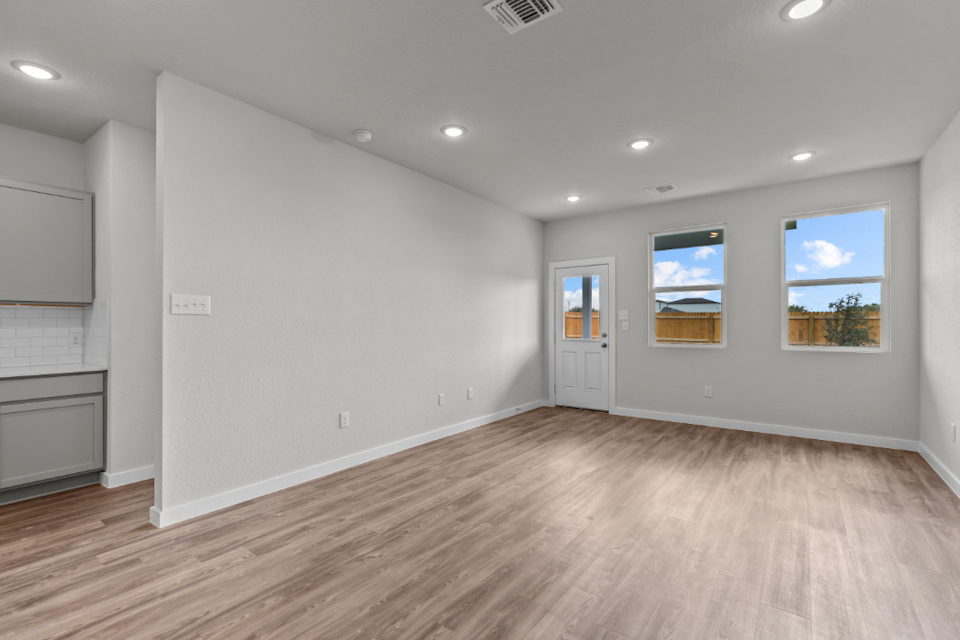 A room with a wood floor and a wood floor.