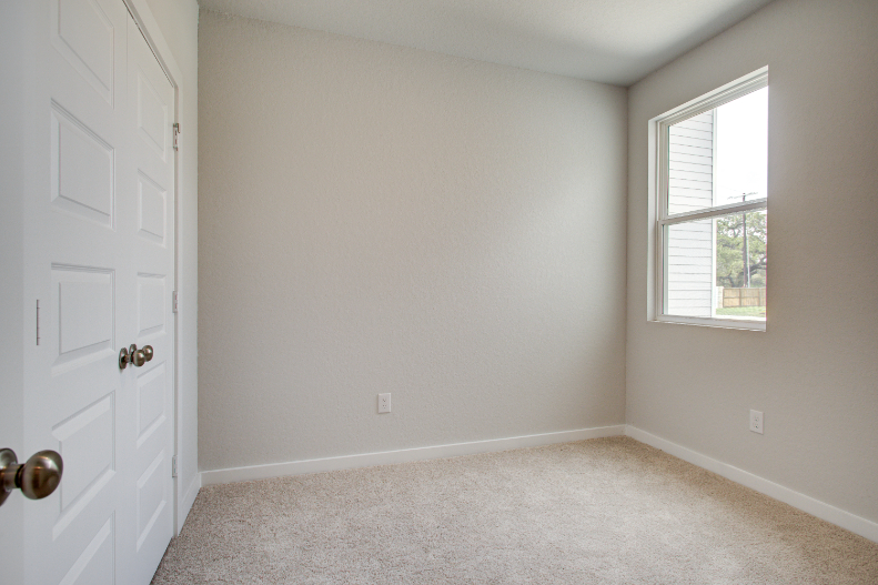 A room with a door and a window.