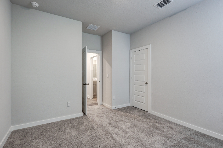 A hallway with white walls.