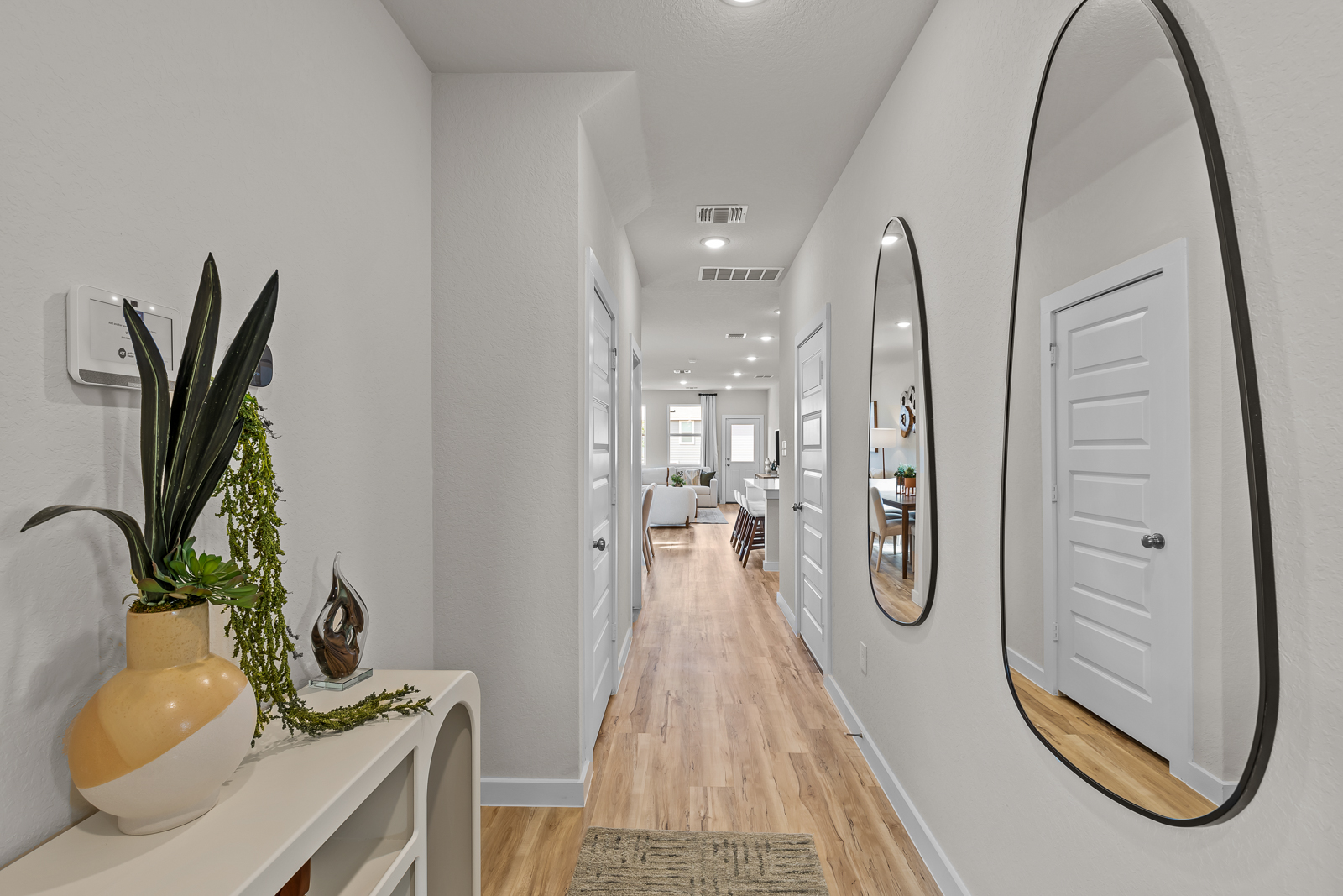 A hallway with white walls.