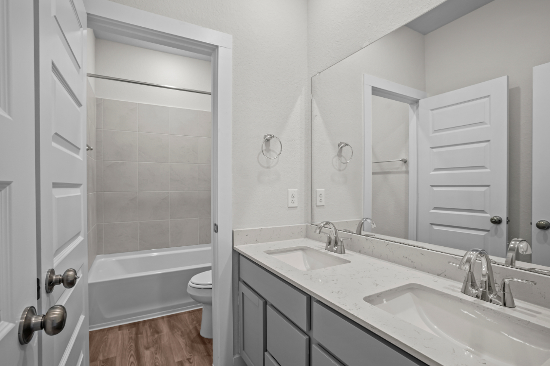 A bathroom with a sink and a bathtub.
