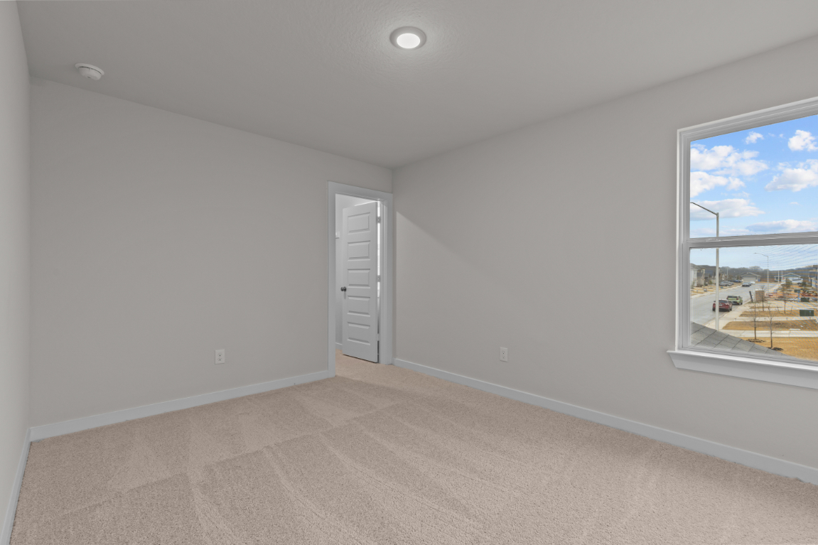 A room with a window and a door.