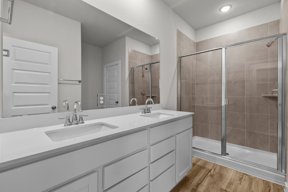 A bathroom with a glass shower.