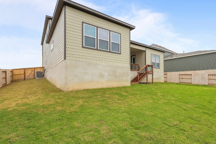 A house with a grass yard.