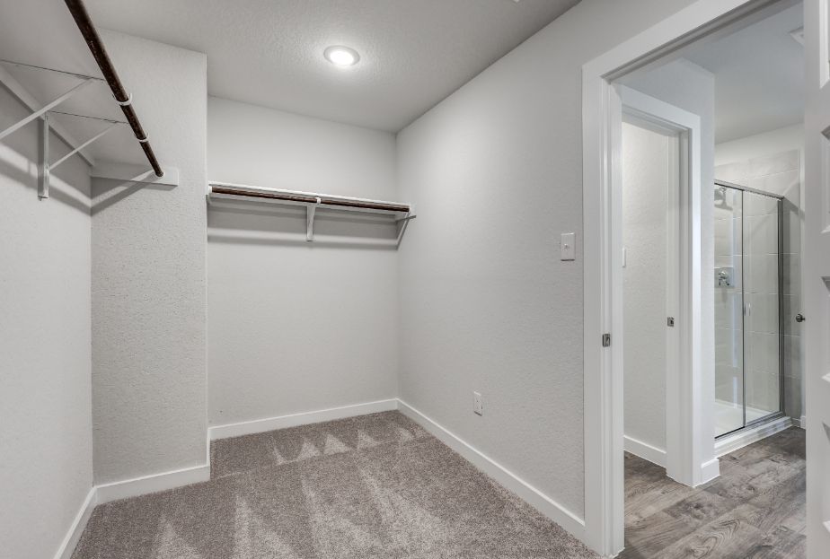 A room with a glass door and a glass shower.