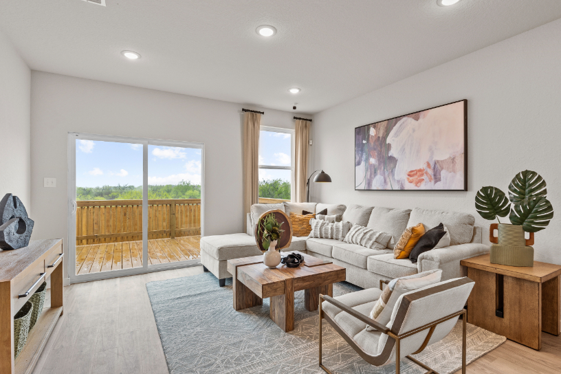 A living room with a large glass door.