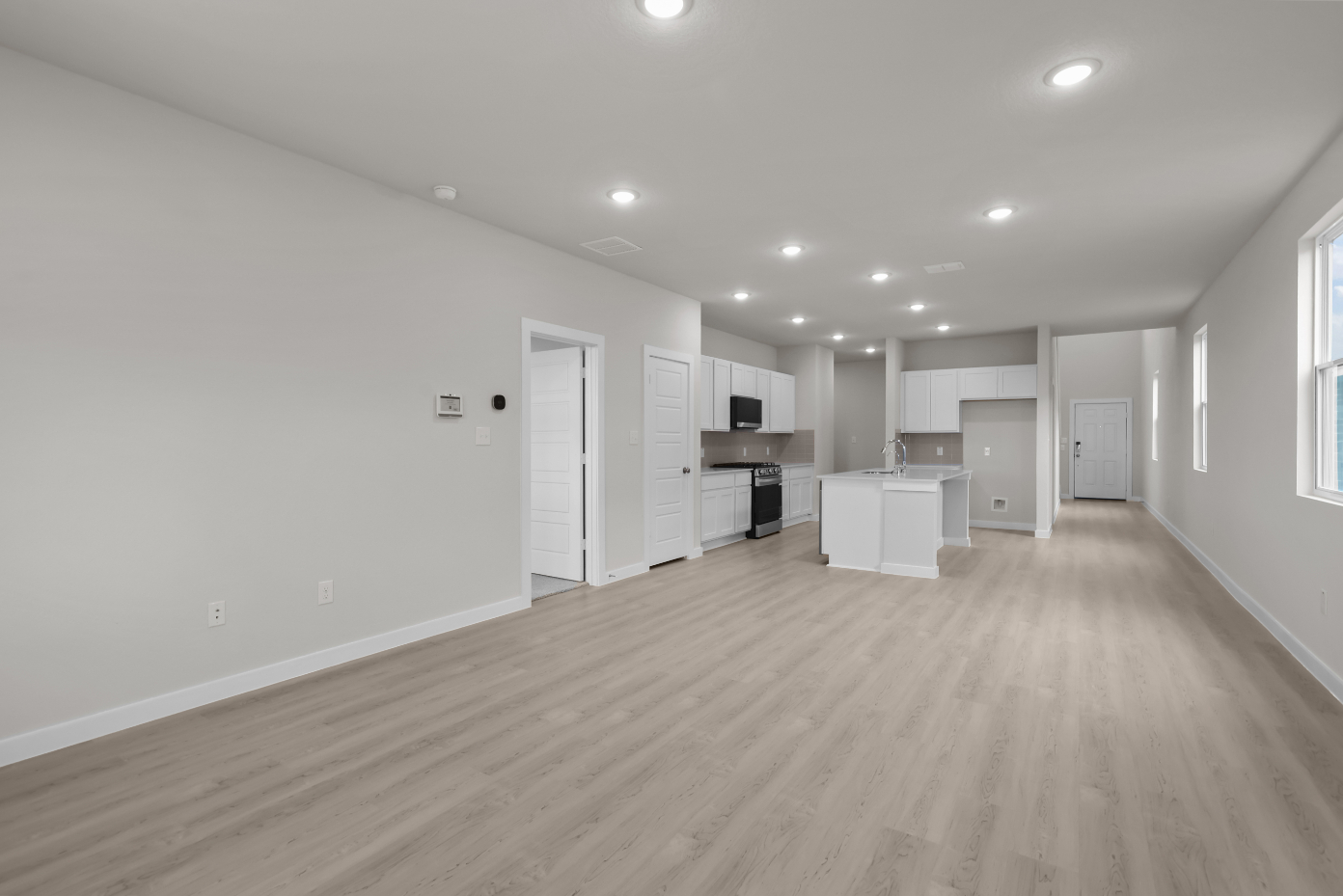 A room with white cabinets.