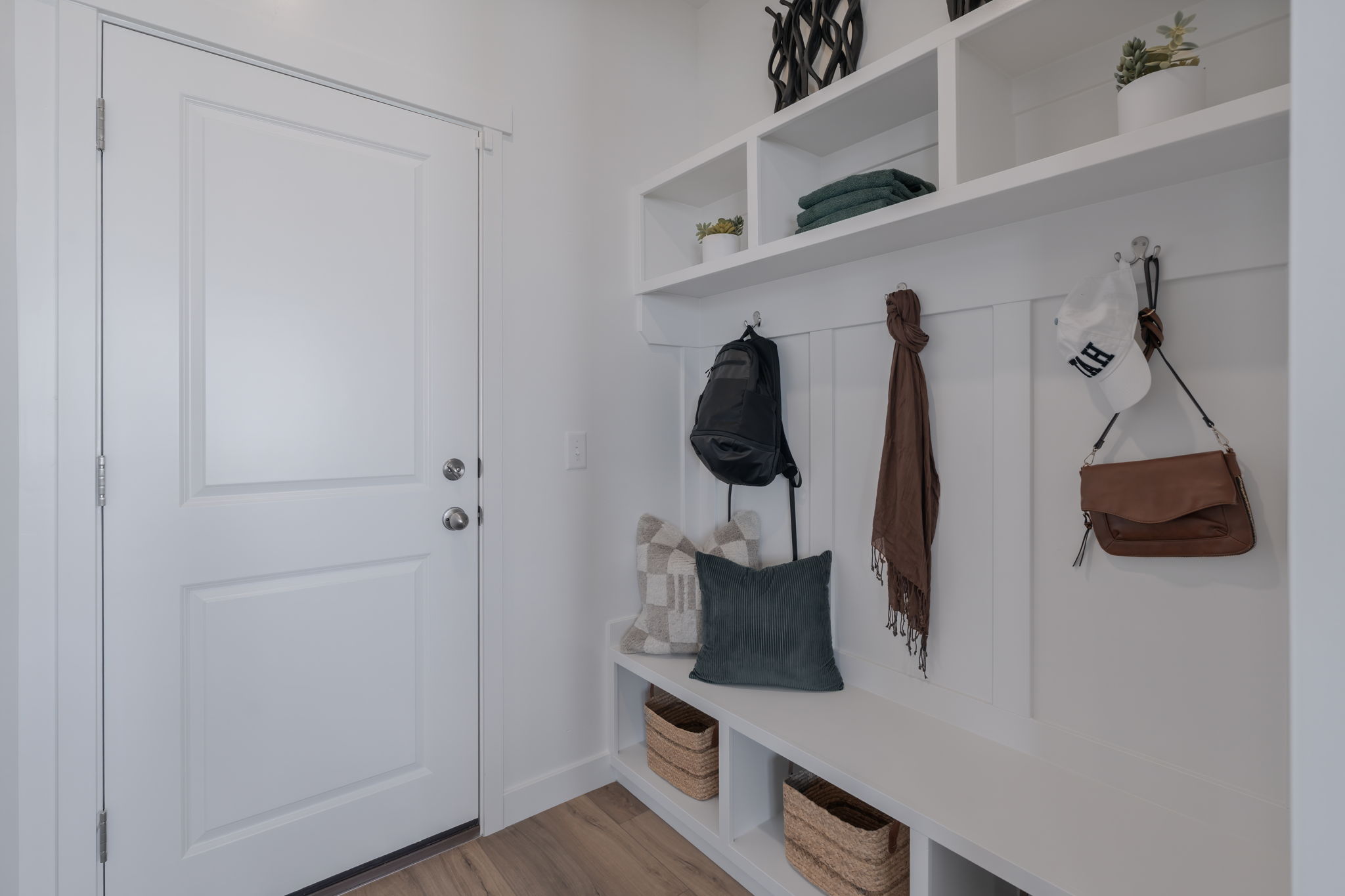 A white closet with a white door and a white door with a white door and a white door.