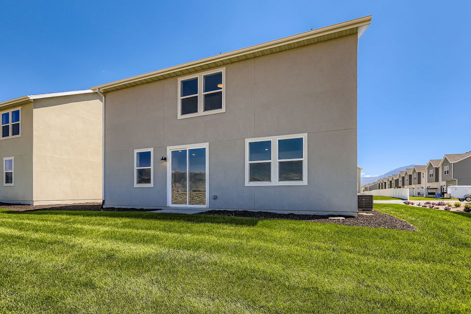 A house with a grass yard.