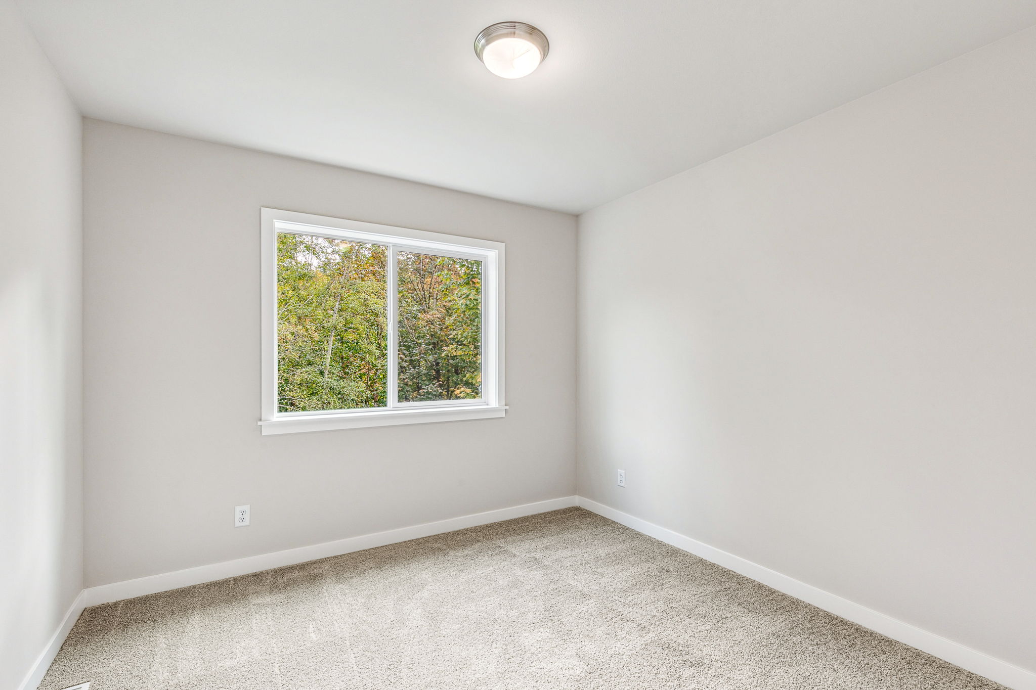 A room with a window and a light.