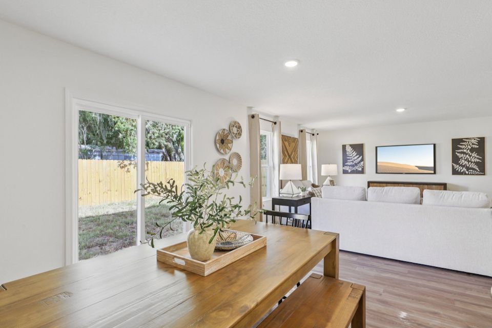 A living room with a large window.