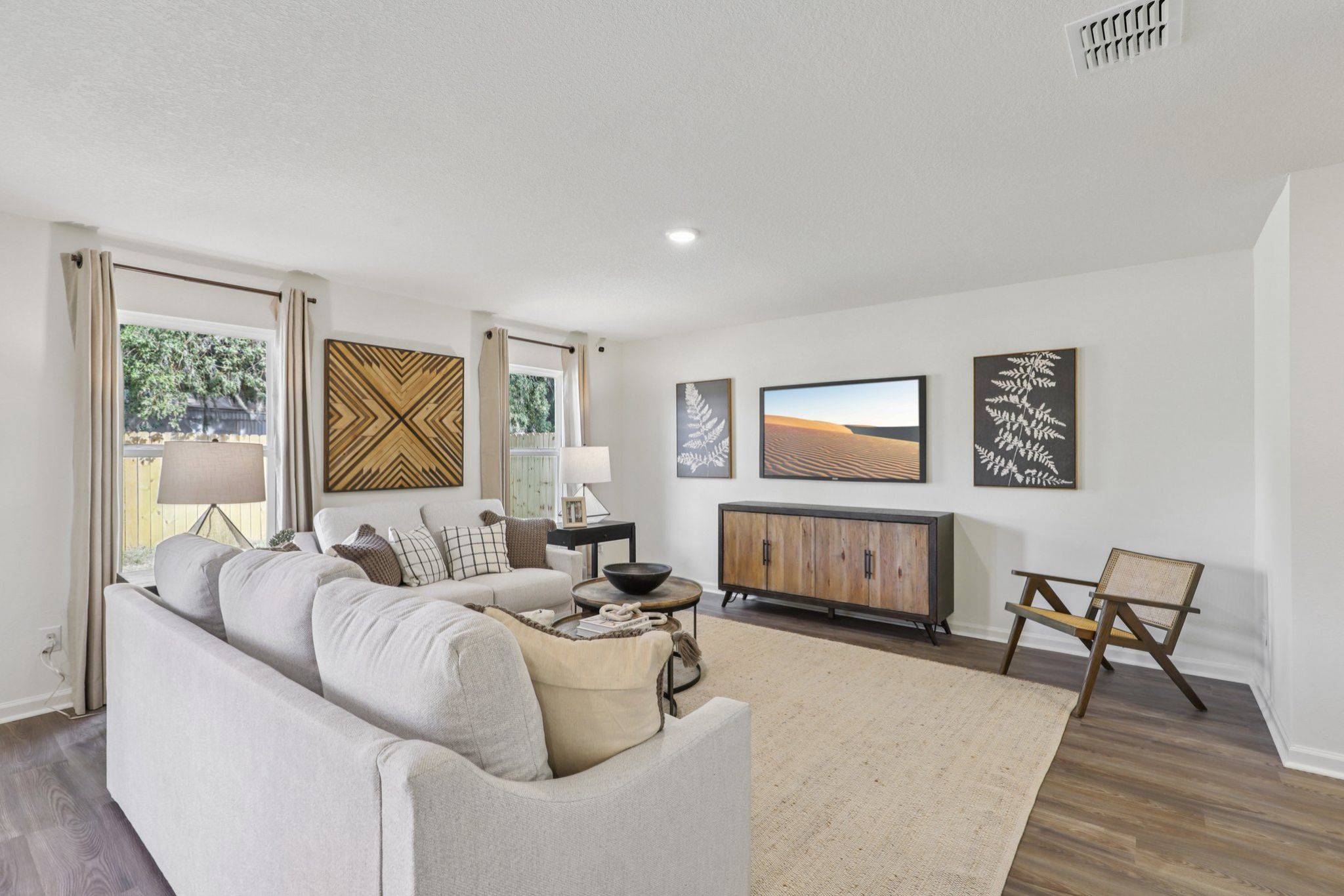 A living room with a white couch.