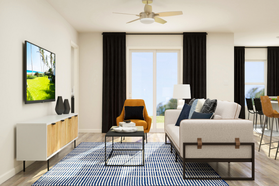 A living room with a couch and a table.