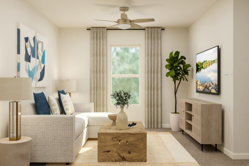A living room with a couch and a table.