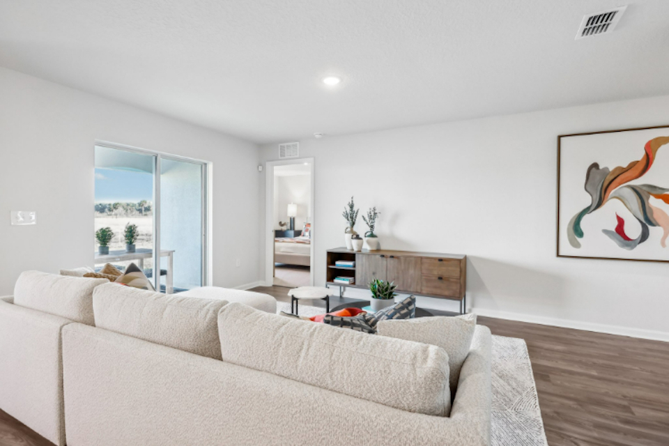 A living room with a couch and a table.