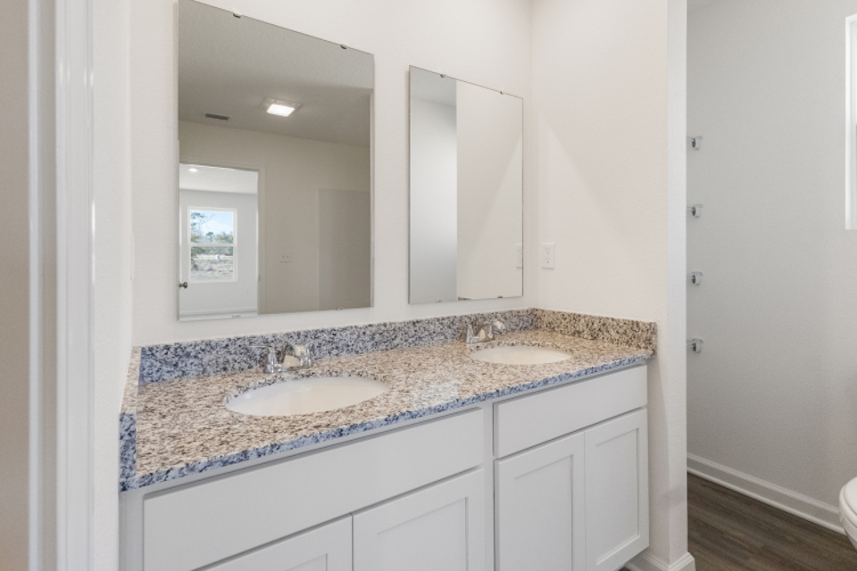 A bathroom with a marble countertop.