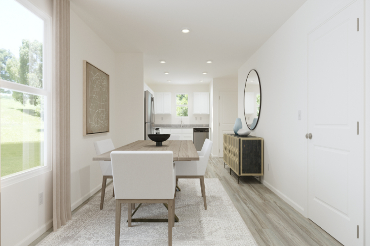 A room with a table and chairs.