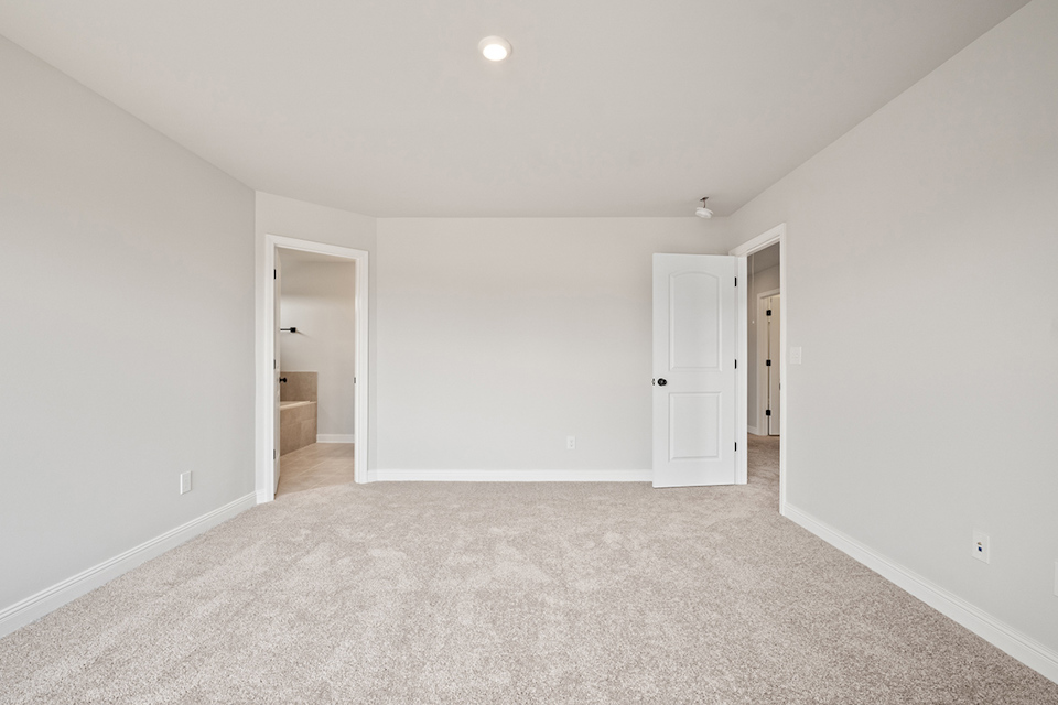 A hallway with white walls.