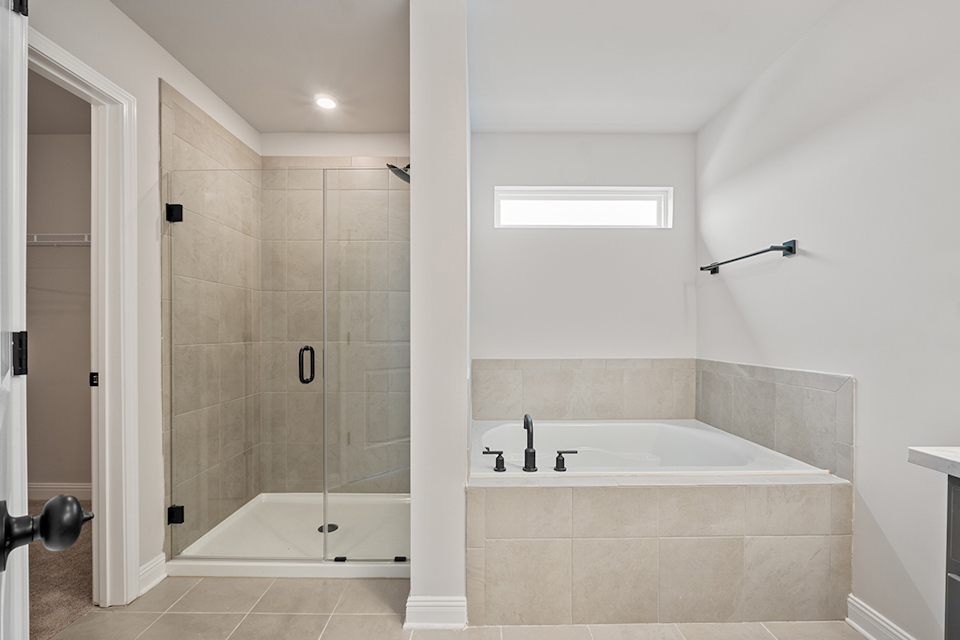 A bathroom with a glass shower.