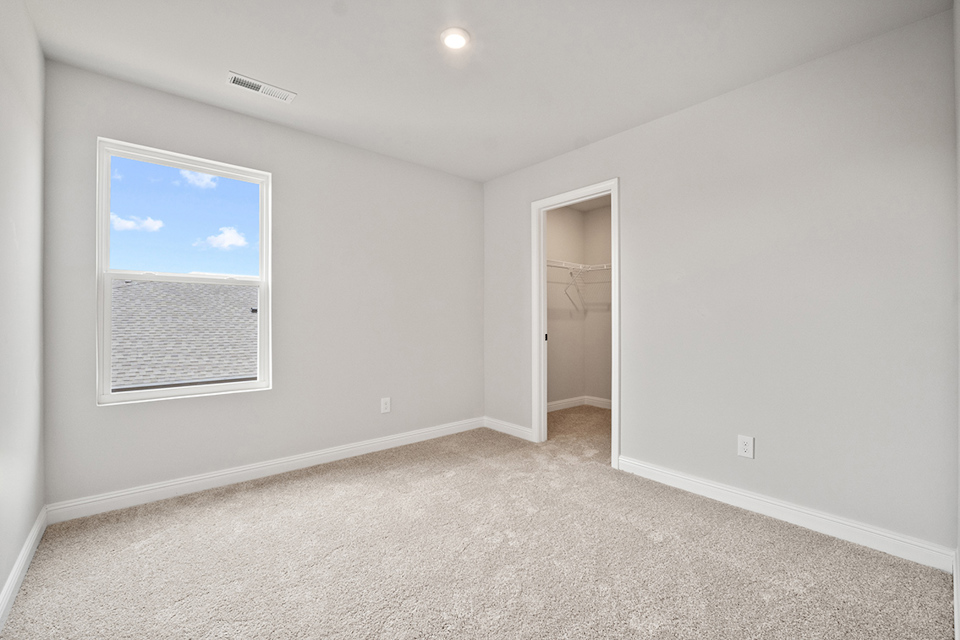 A room with a door and a window.