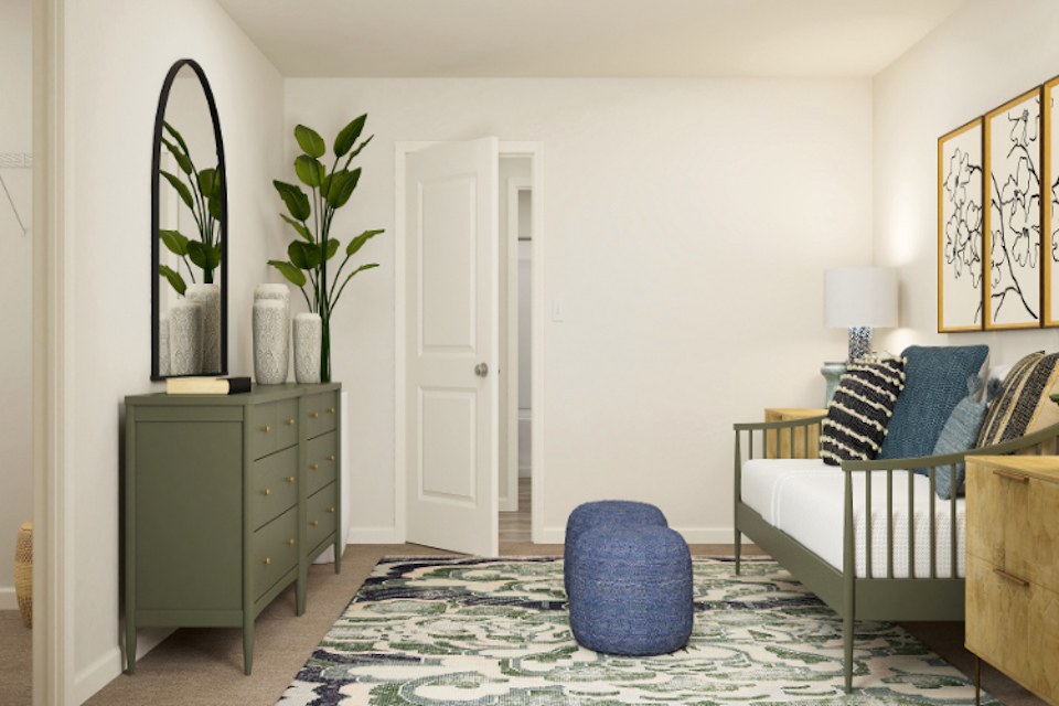 A room with a bed and a chair.
