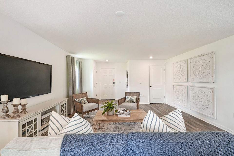 A living room with a tv and couches.