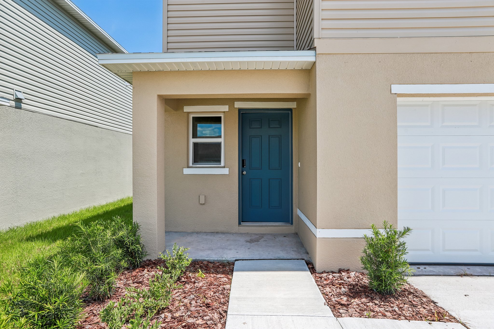 A house with a garage door.