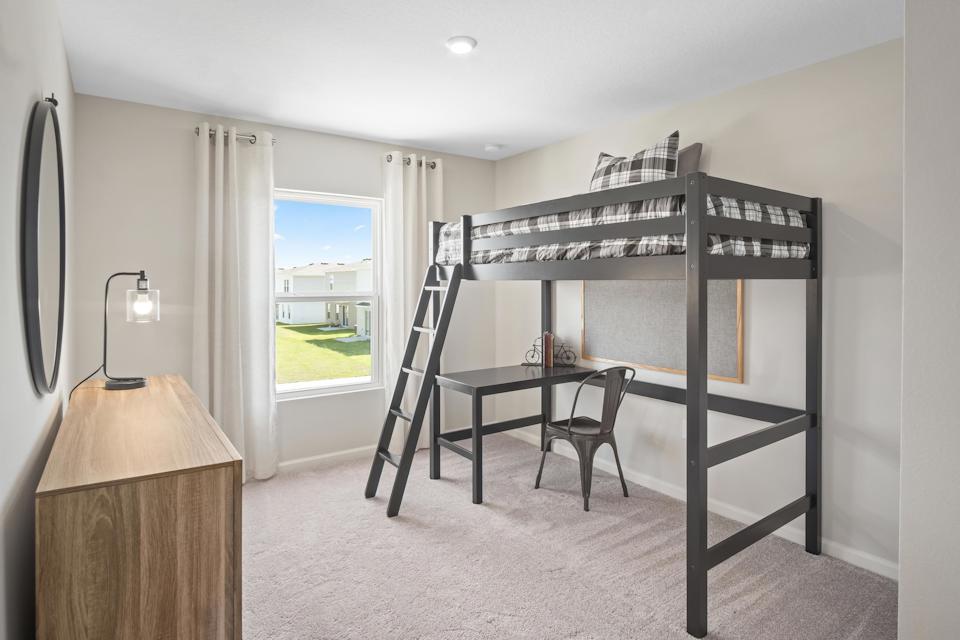 A room with a bed and a table.
