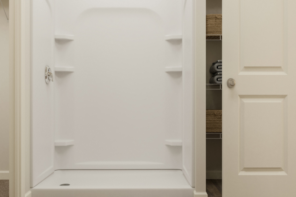 A white bathtub in a bathroom.