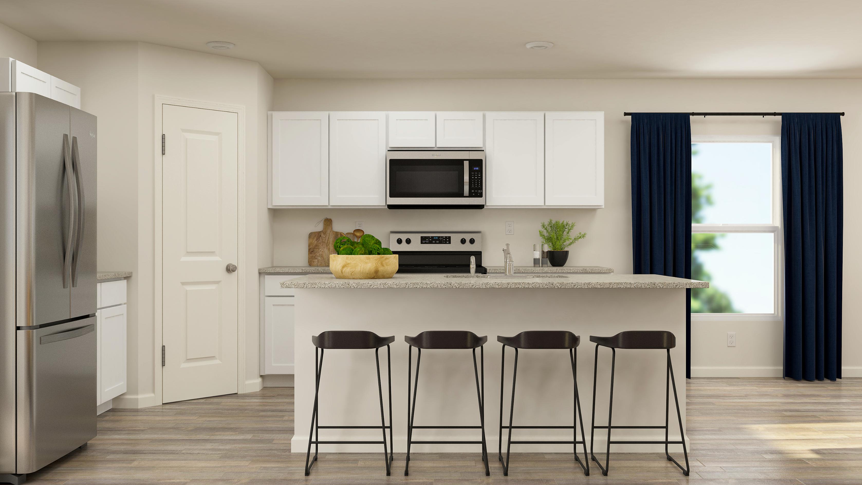 A kitchen with white cabinets.