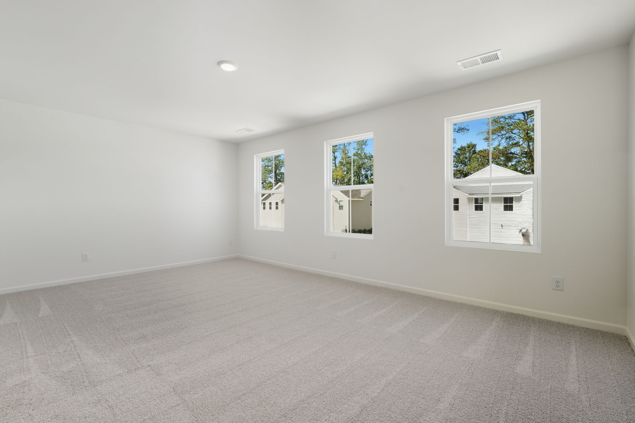 A room with a few paintings on the wall.